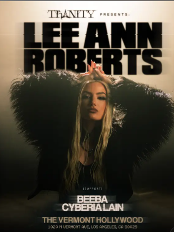 Promotional poster featuring a woman with long blonde hair in a black feathered coat, hands raised above her head, with 'LEE ANN ROBERTS' text at the top and event details at the bottom.