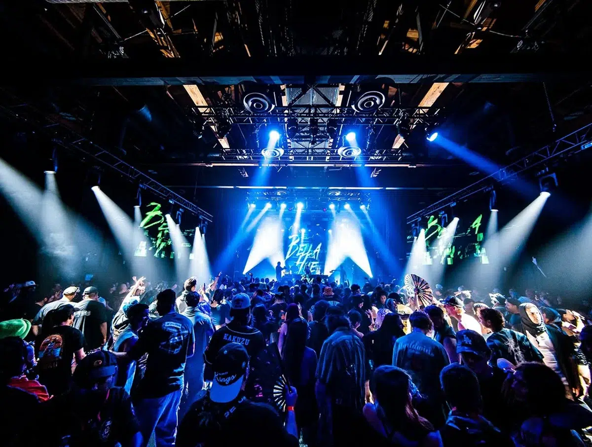 Vermont Hollywood concert crowd with blue stage lighting and LED screens